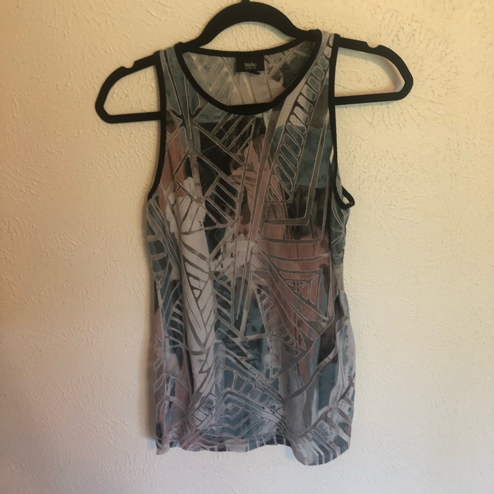 Colorful sleeveless shirt with detailing.